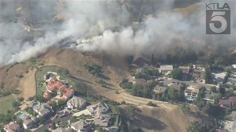 Multi-acre brush fire threatening homes in Los Angeles County contained